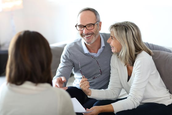 Senior couple meeting financial adviser for investment